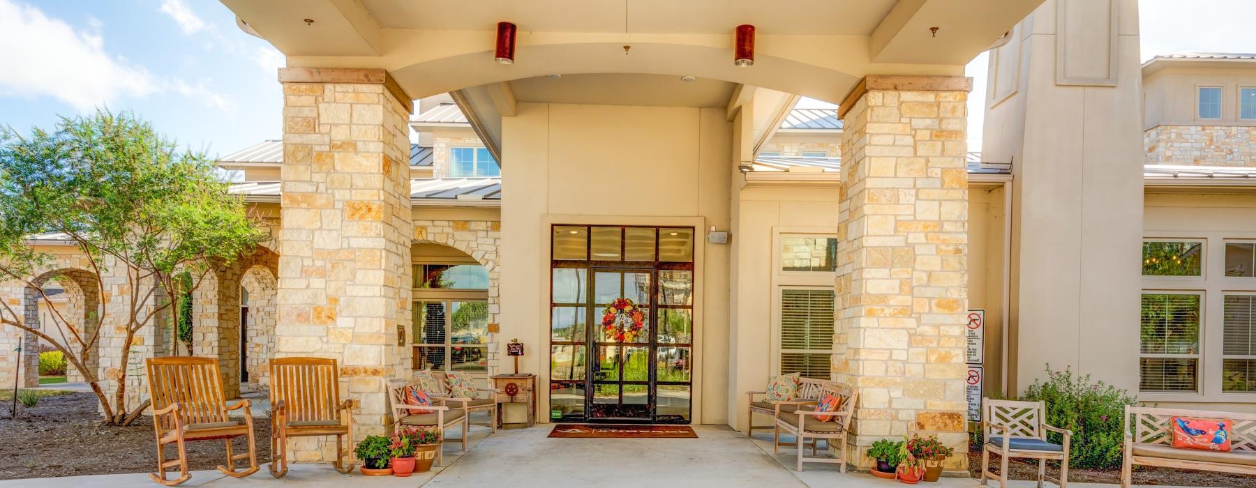 a building with a patio and chairs