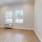 a room with a wood floor and a window