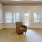 a room with a chair and a door