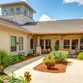 Find your perfect fit at The Auberge at Cedar Park a patio with plants and a chair