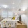 a bedroom with a bed and a lamp