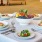 a table with plates of food and glasses on it