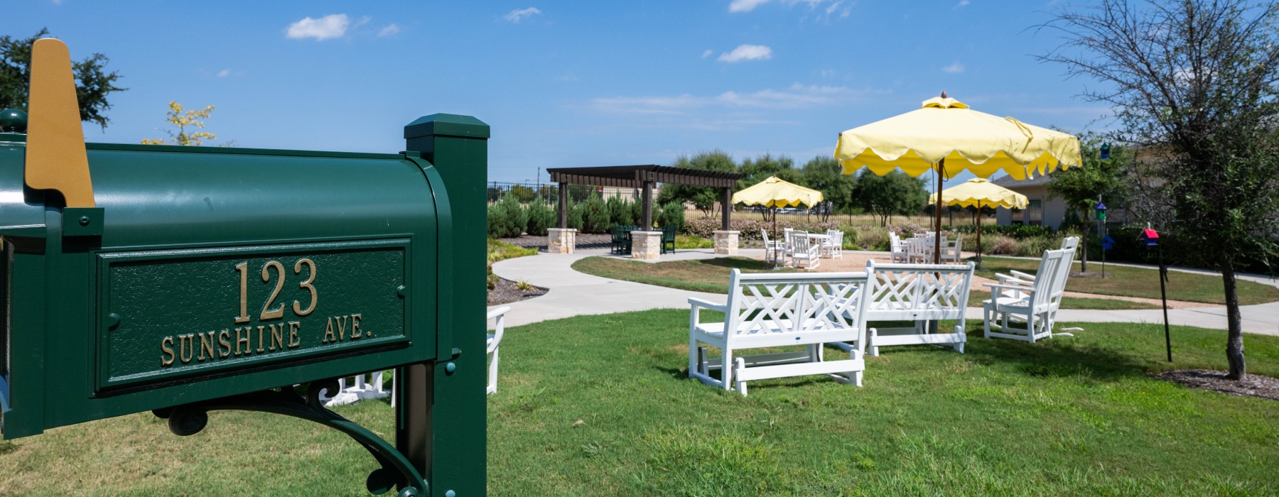 Outdoor courtyard with seating and mailbox