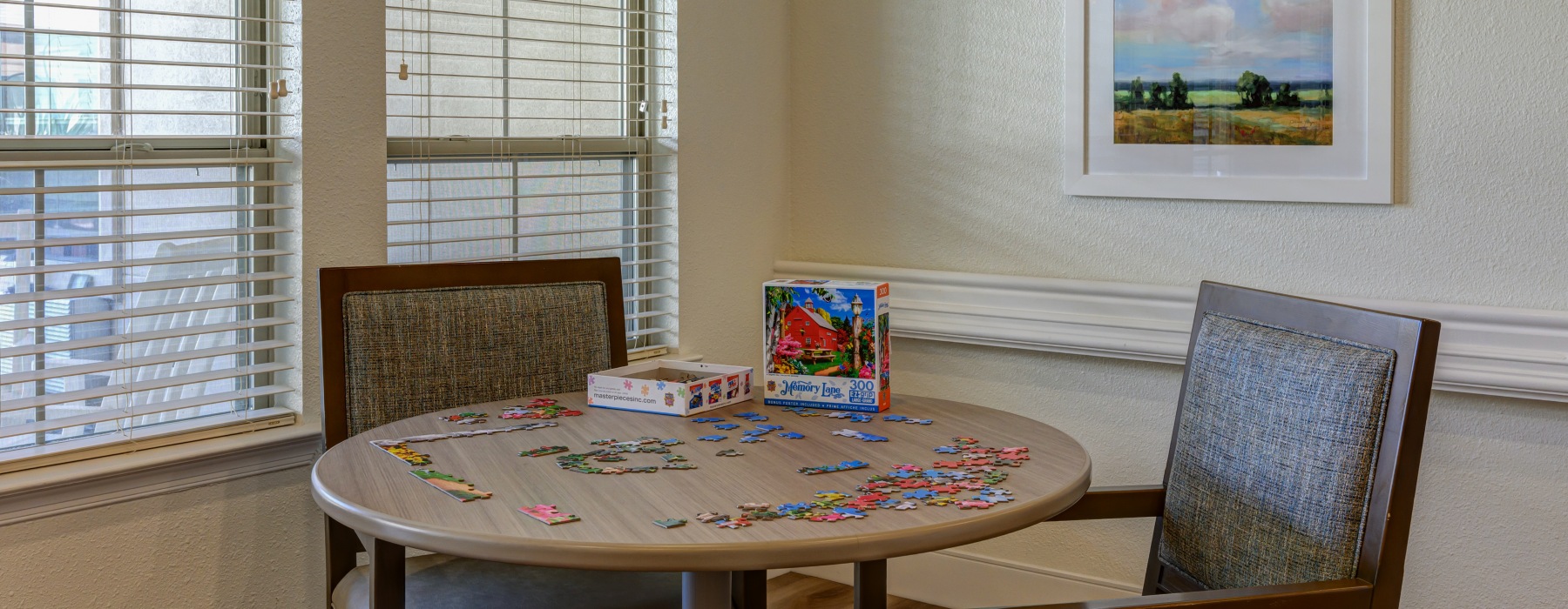 Table and chairs with a puzzle laid out