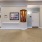a room with a white wall and a wood frame