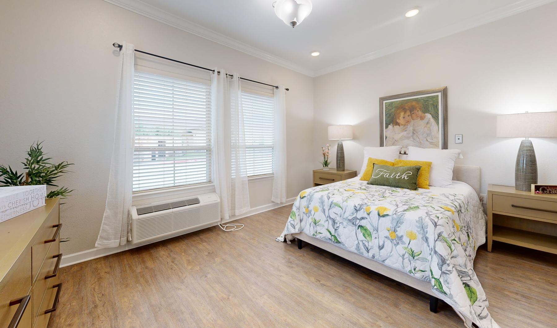 Relax and recharge in beautiful and spacious bedrooms a bedroom with a bed and a window