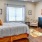 a bedroom with a bed and dresser