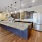 a kitchen with a marble island