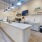 a kitchen with white cabinets