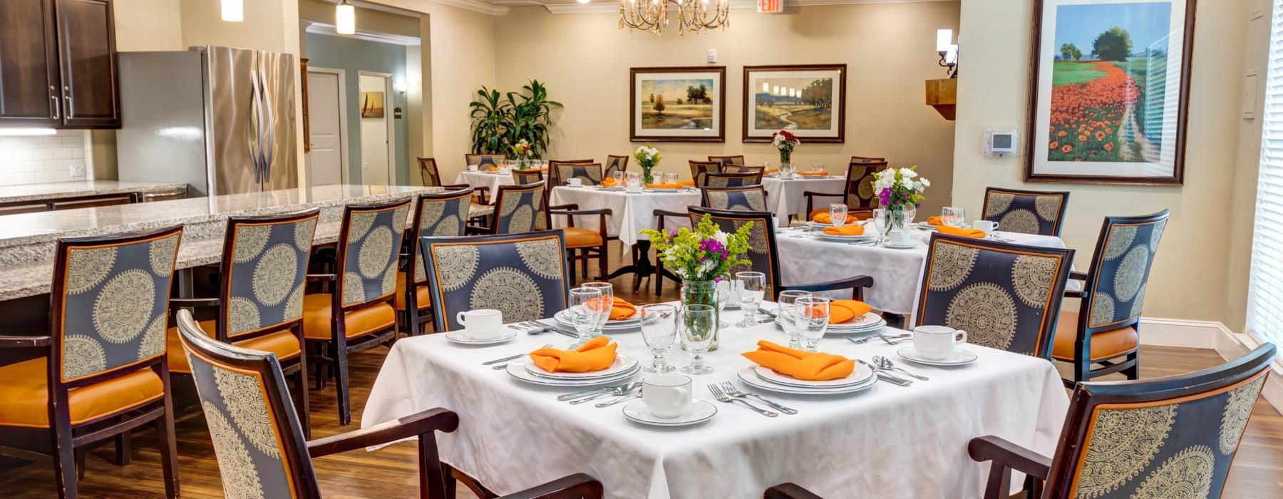 a dining room with tables set